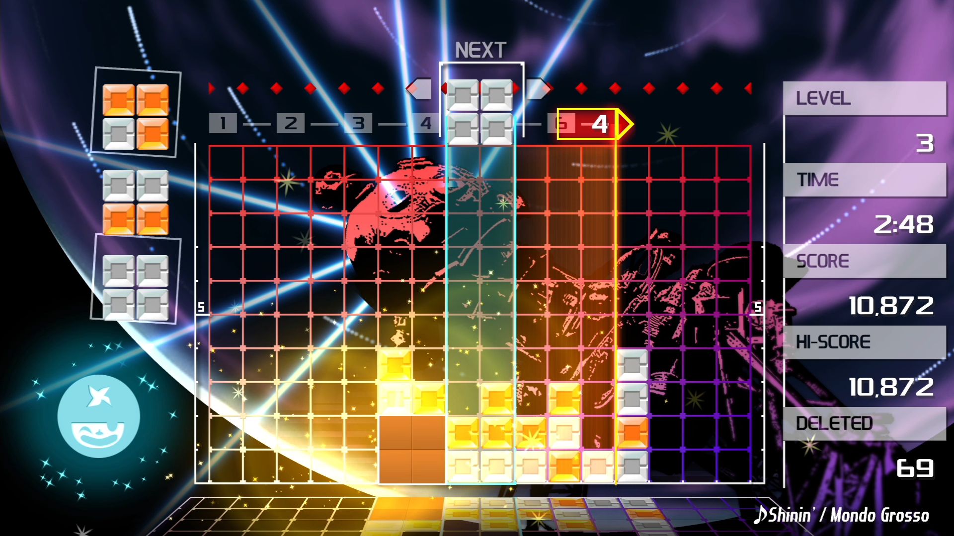 One of the many Tetris games, Lumines (not really a Tetris game but kind of similar). In action it shows various blocks falling along a grid, with numbers at the top denoting the music. It is all very colourful.