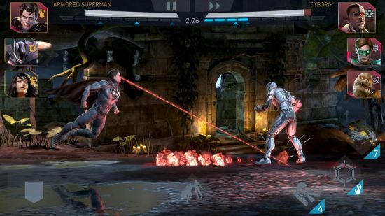 Giochi di Batman - Superman spara raggi laser a Cyborg in una visuale laterale dei due che combattono.