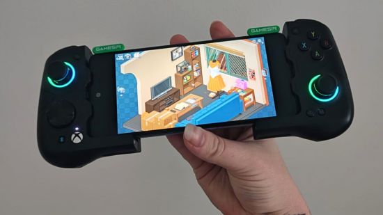 gamesir x4 aileron review - Unpacking on a mobile against a white wall