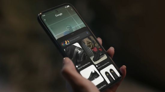 Screenshot of a Google Pixel 8a in a users hands from the official ad for Verizon deals post