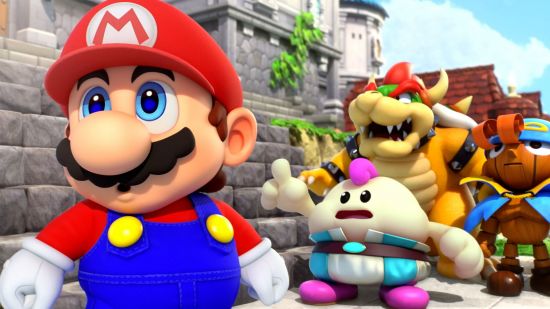 Mario and other characters stood in front of a castle pointing at at something out of the shot