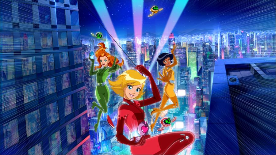 Totally Spies! - Cyber Mission key art showing Sam, Clover, and Alex swinging among tall buildings at night