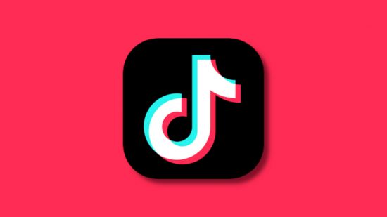 What is TikTok: The TikTok black app logo lightly drop-shadowed onto a vibrant pinkish-red backdrop, similar to the red in the logo
