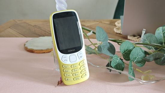 Custom image for Nokia 3210 review with the phone delicately placed on a table