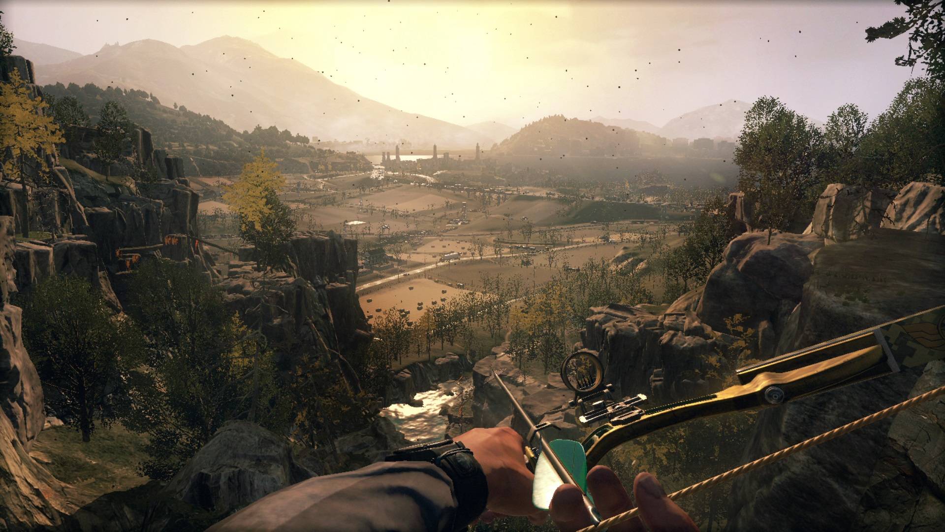 best post-apocalyptic games. A FPS view shows a character holding a cross-bow looking out over a sunset and a large open world