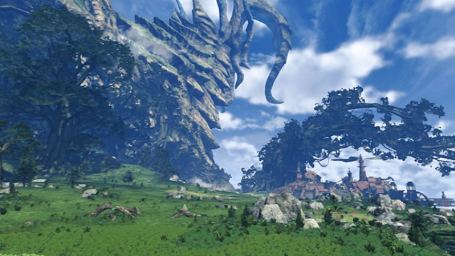 A wide shot from Xenoblade Chronicles 2, showing a large towering creature that looks like a mountain. There's a wide open plain below, grassy, covered in trees. The sky is blue and cloudy.